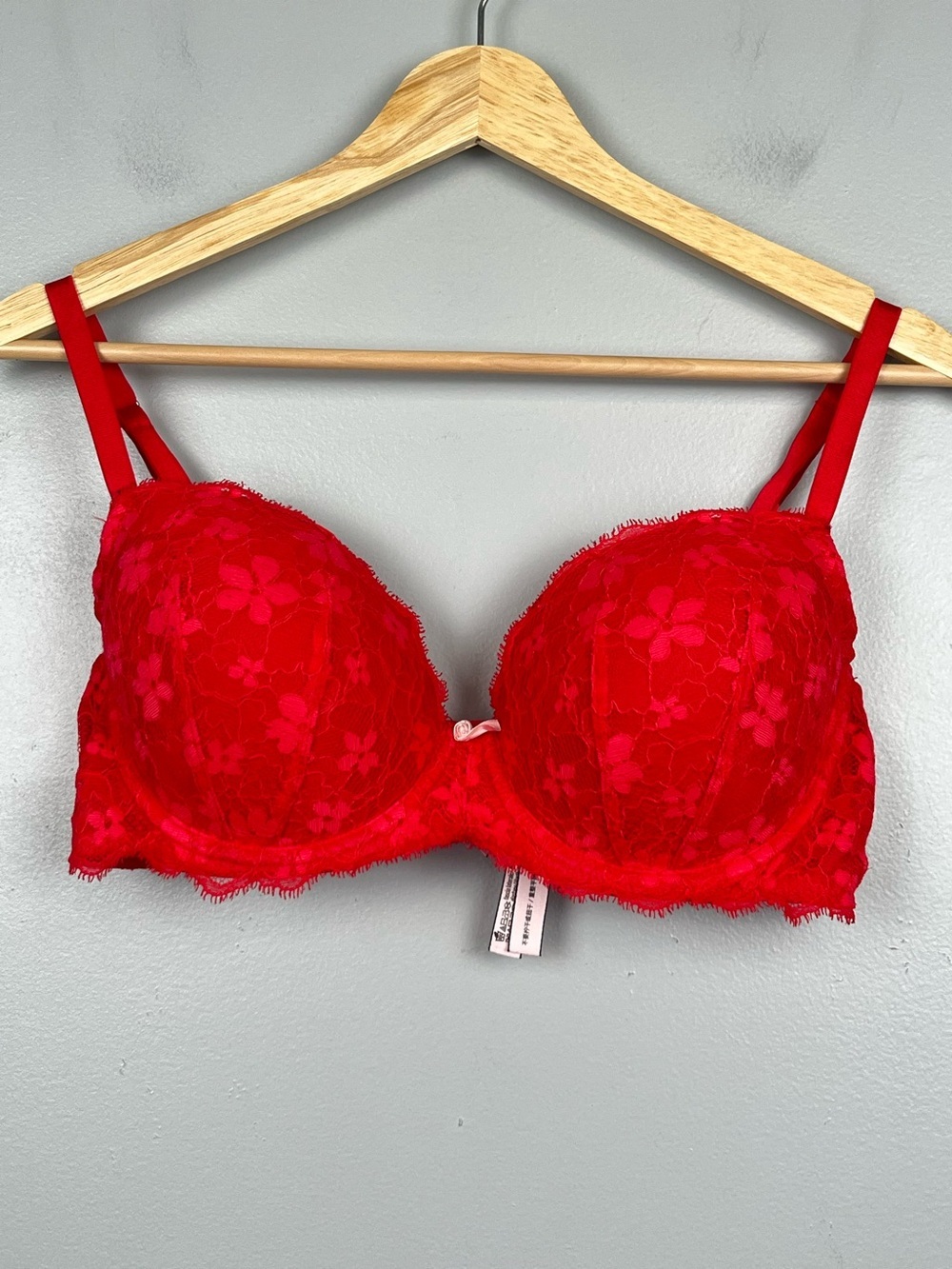 Victoria’s Secret reddish pink Dream Angels lined Demi lace overlay bra, 36D.